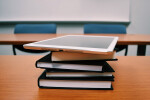 Tablet on stack of books
